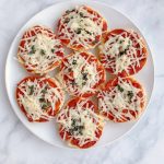 Homemade Vegan Bagel Bites are mini bagels topped with your favorite pizza ingredients then baked for 10 minutes. Quick and easy meatless meal!
