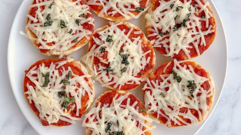 Homemade Vegan Bagel Bites are mini bagels topped with your favorite pizza ingredients then baked for 10 minutes. Quick and easy meatless meal!