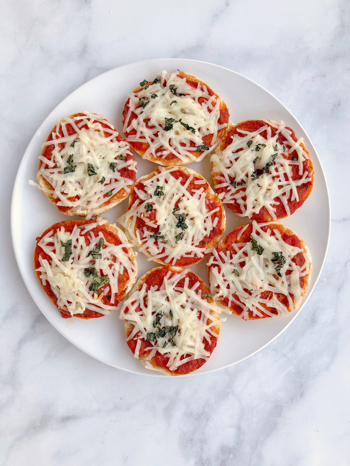 Homemade Vegan Bagel Bites are mini bagels topped with your favorite pizza ingredients then baked for 10 minutes. Quick and easy meatless meal!