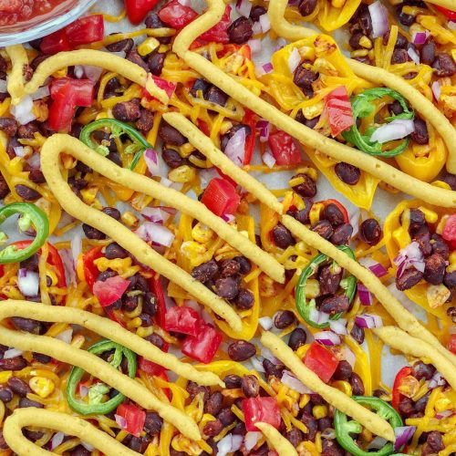 Vegan Mini Sweet Pepper Nachos are the ultimate low-carb, dairy-free, and gluten-free snack sure to please any crowd. Pefect for parties and game day!