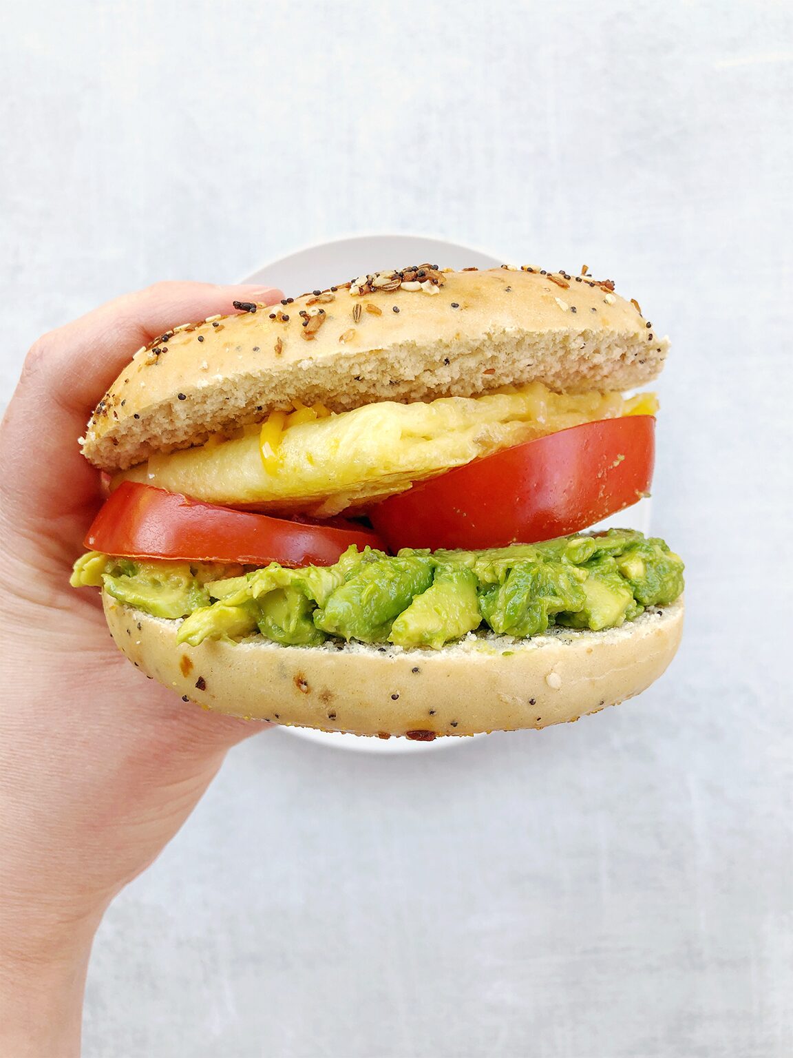 Vegan Breakfast Bagel Sandwich with Tomato and Avocado