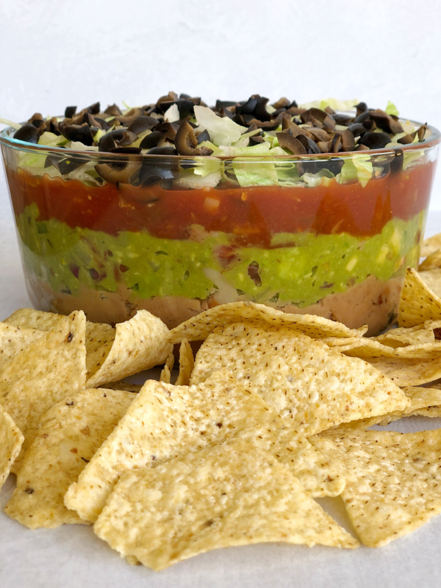 cropped-This-quick-and-easy-Dairy-Free-5-Layer-Dip-Recipe-comes-together-with-vegetarian-refried-beans-chunky-guacamole-flavorful-salsa-shredded-lettuce-and-sliced-olives..png