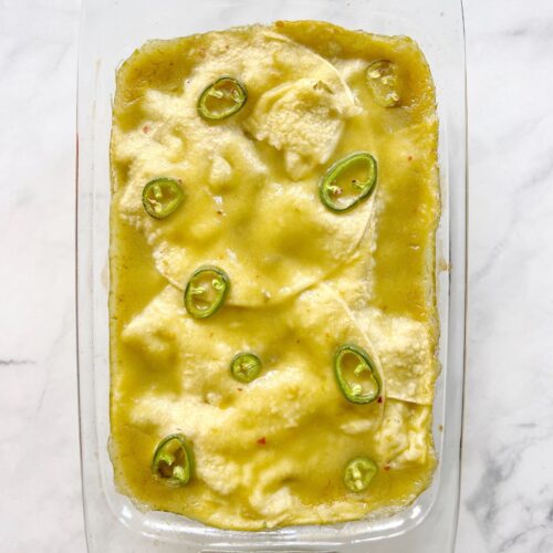 baked vegan enchilada casserole in baking dish.