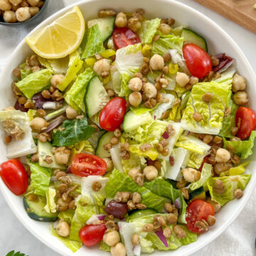 chickpea and lentil salad in big white bowl.
