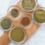 homemade poultry seasoning ingredients in bowls.