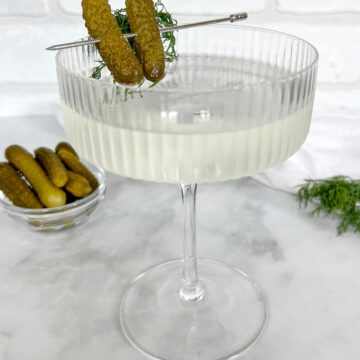 dirty pickle martini in coupe.