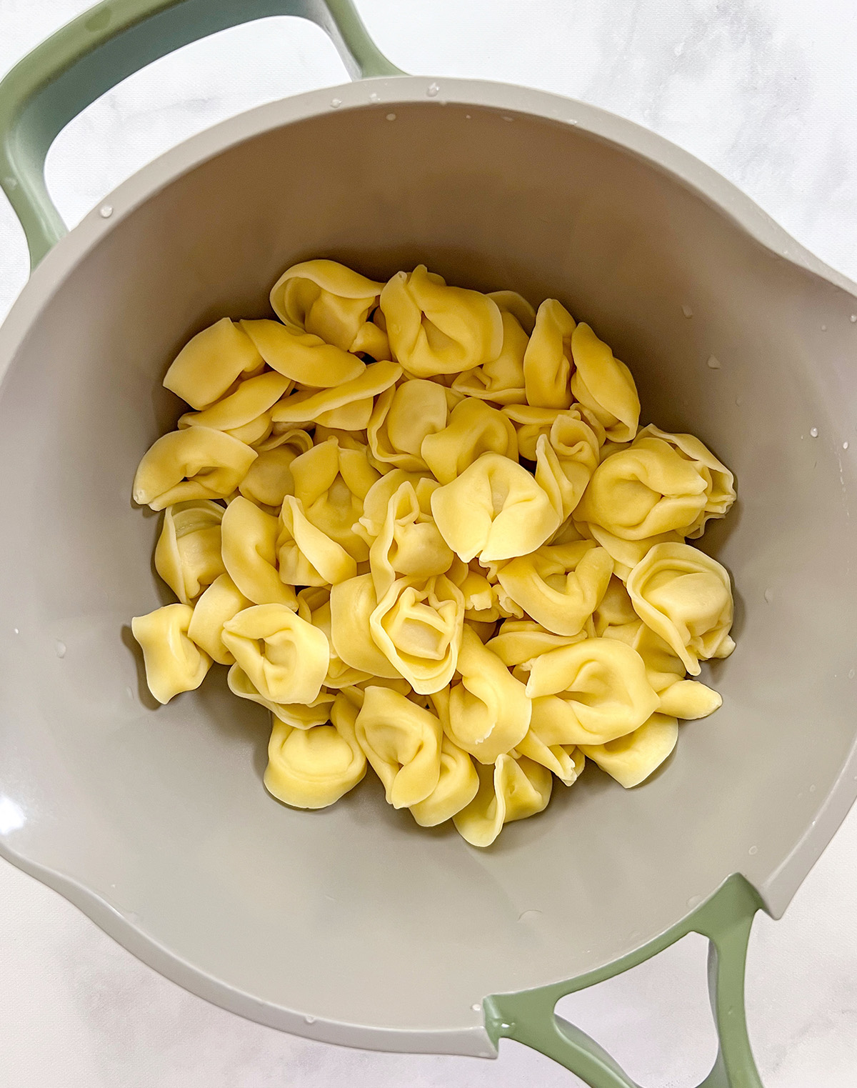 al dente cooked dairy free tortellini in pot.