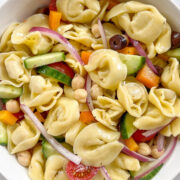 vegan tortellini pasta salad in white bowl.