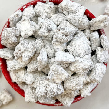 dairy free puppy chow in red serving bowl.