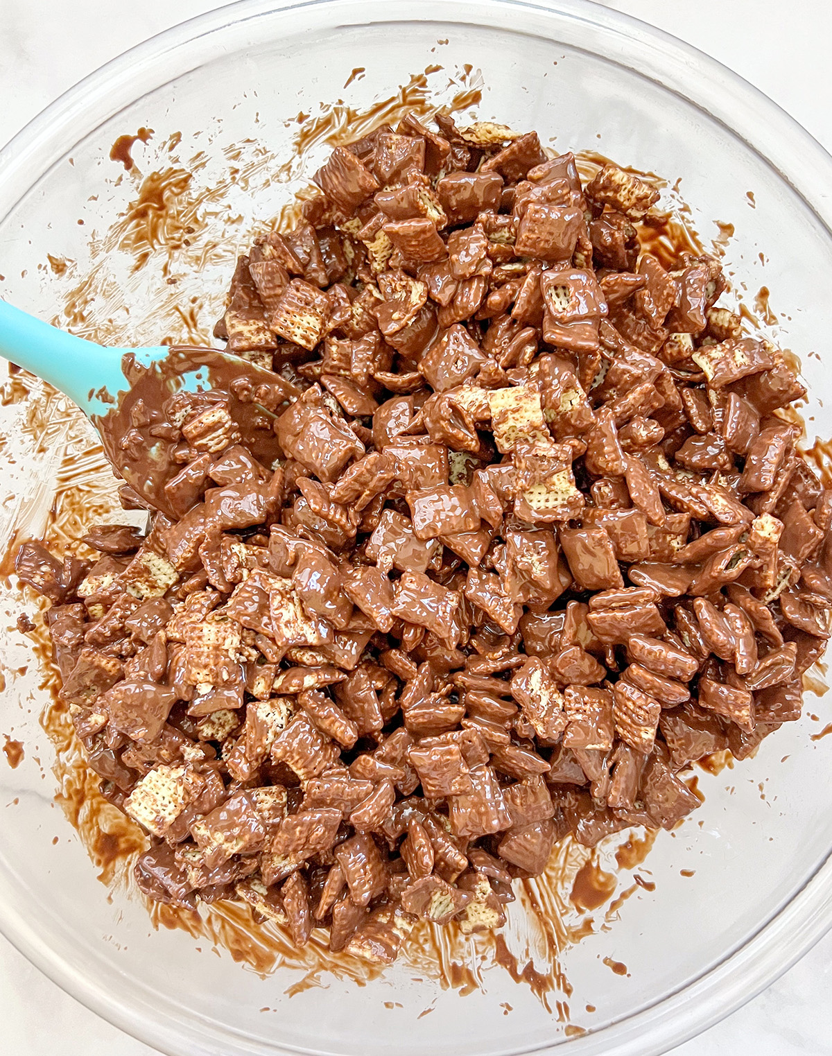 vegan Muddy Buddies Chex Party Mix in mixing bowl.