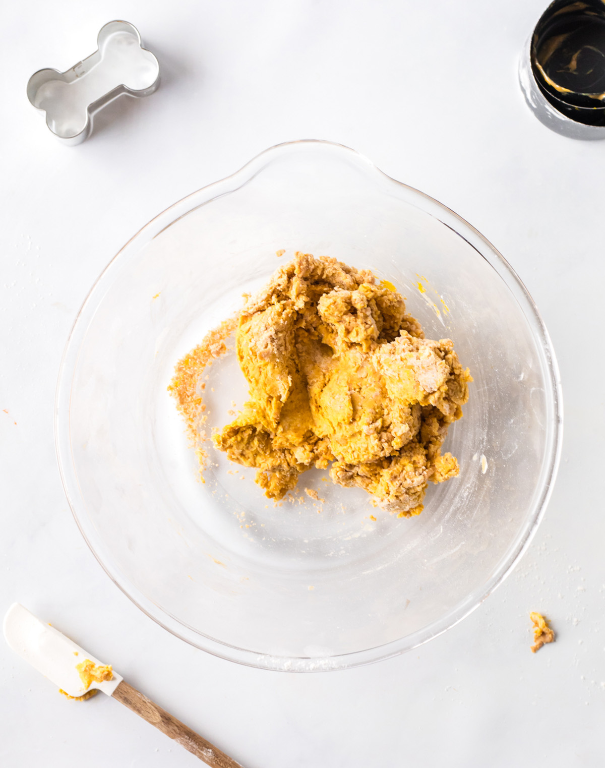 Dog treat dough mixed together in a glass bowl