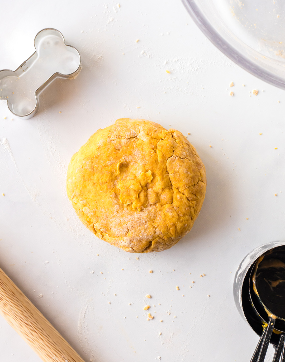 Dough formed into a smooth ball on a floured surface