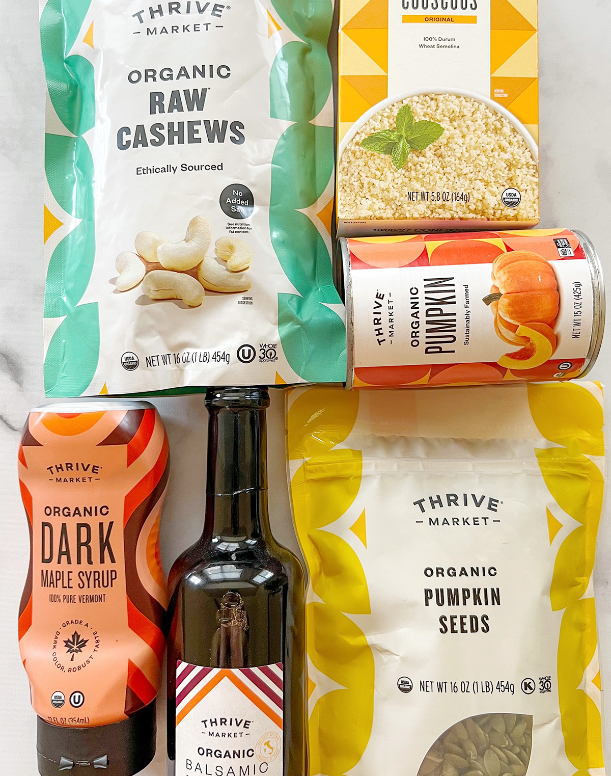 Thrive Market pantry staples including couscous, pumpkin, maple syrup, and balsamic vinegar