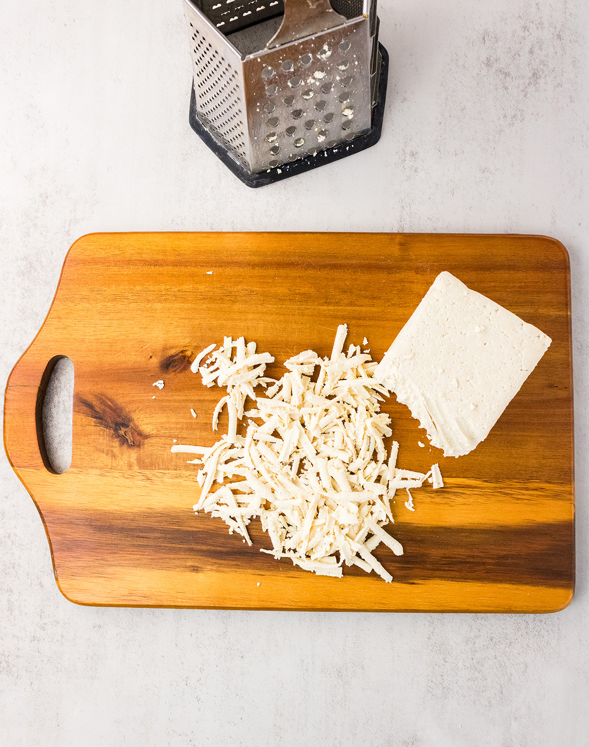 box grater and shredded tofu for vegan tacos
