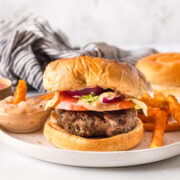 plated dairy free and eggless burgers with fries