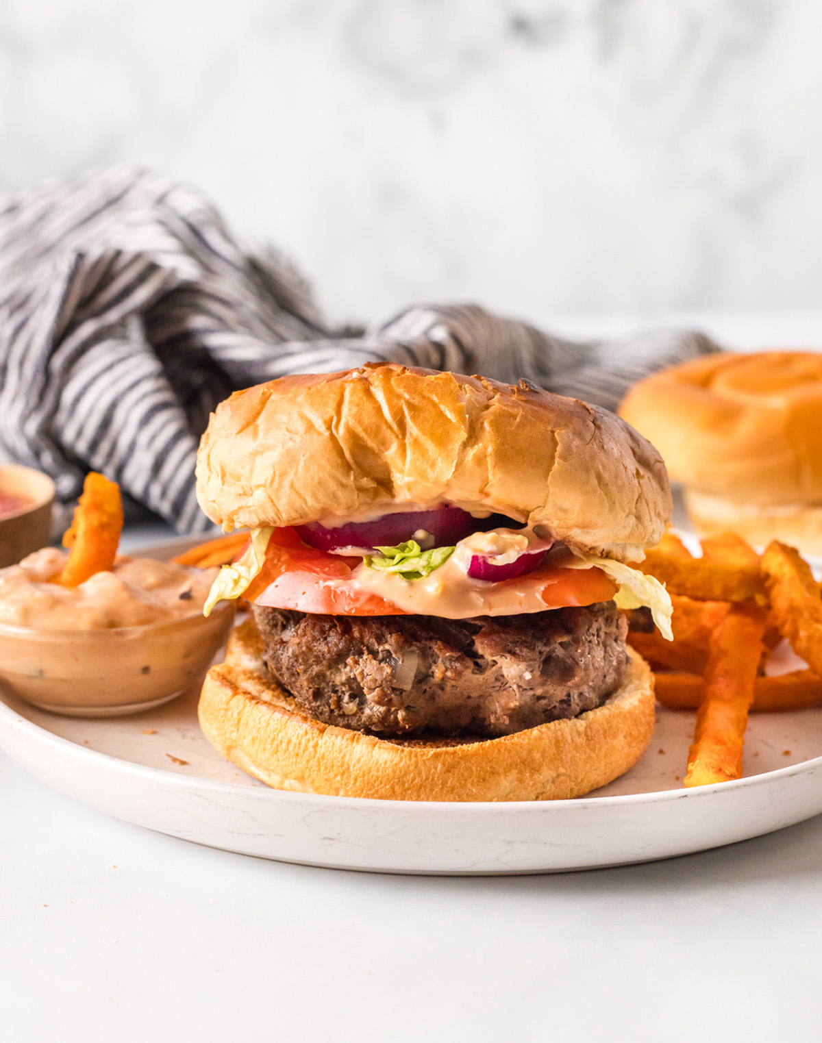 plated dairy free and eggless burgers with fries