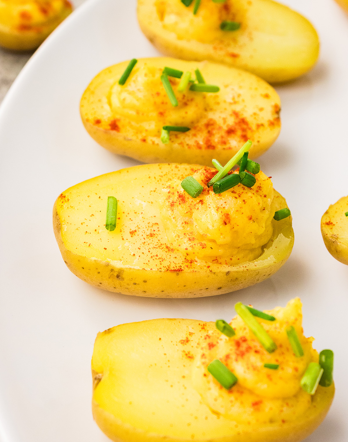 Vegan angel eggs made with baby potatoes and paprika garnish.