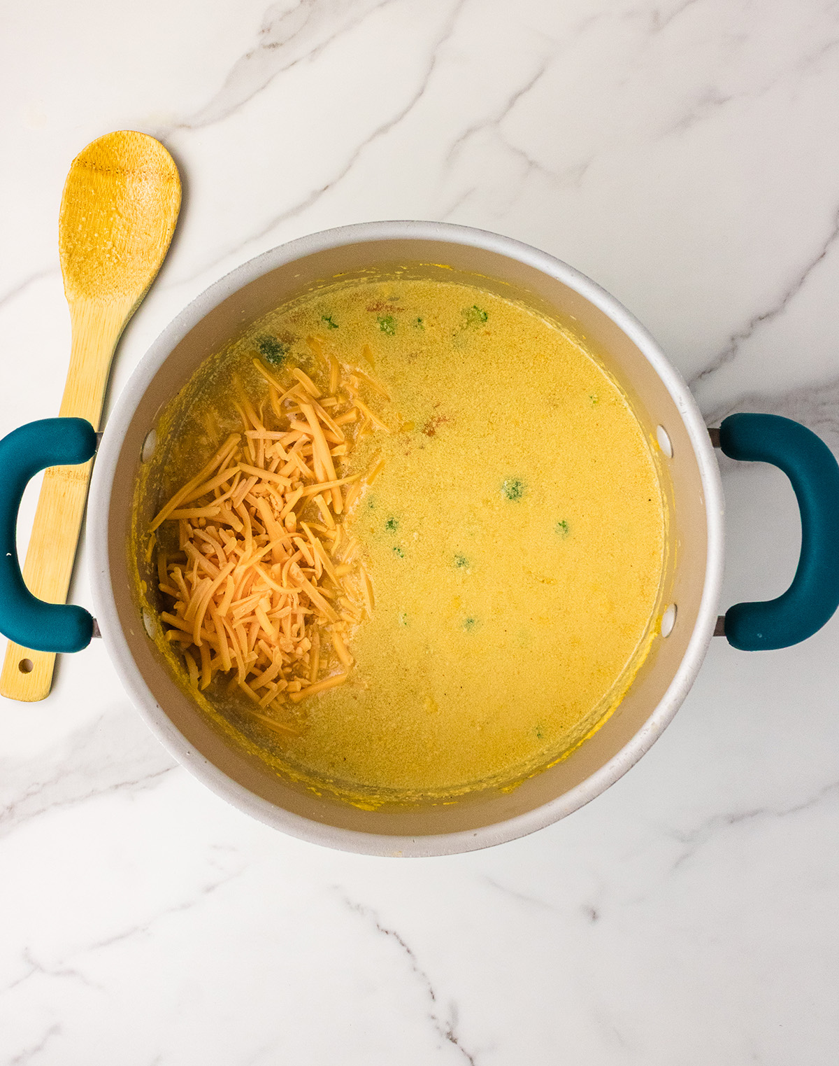 vegan broccoli cheese soup with cheddar cheese shreds