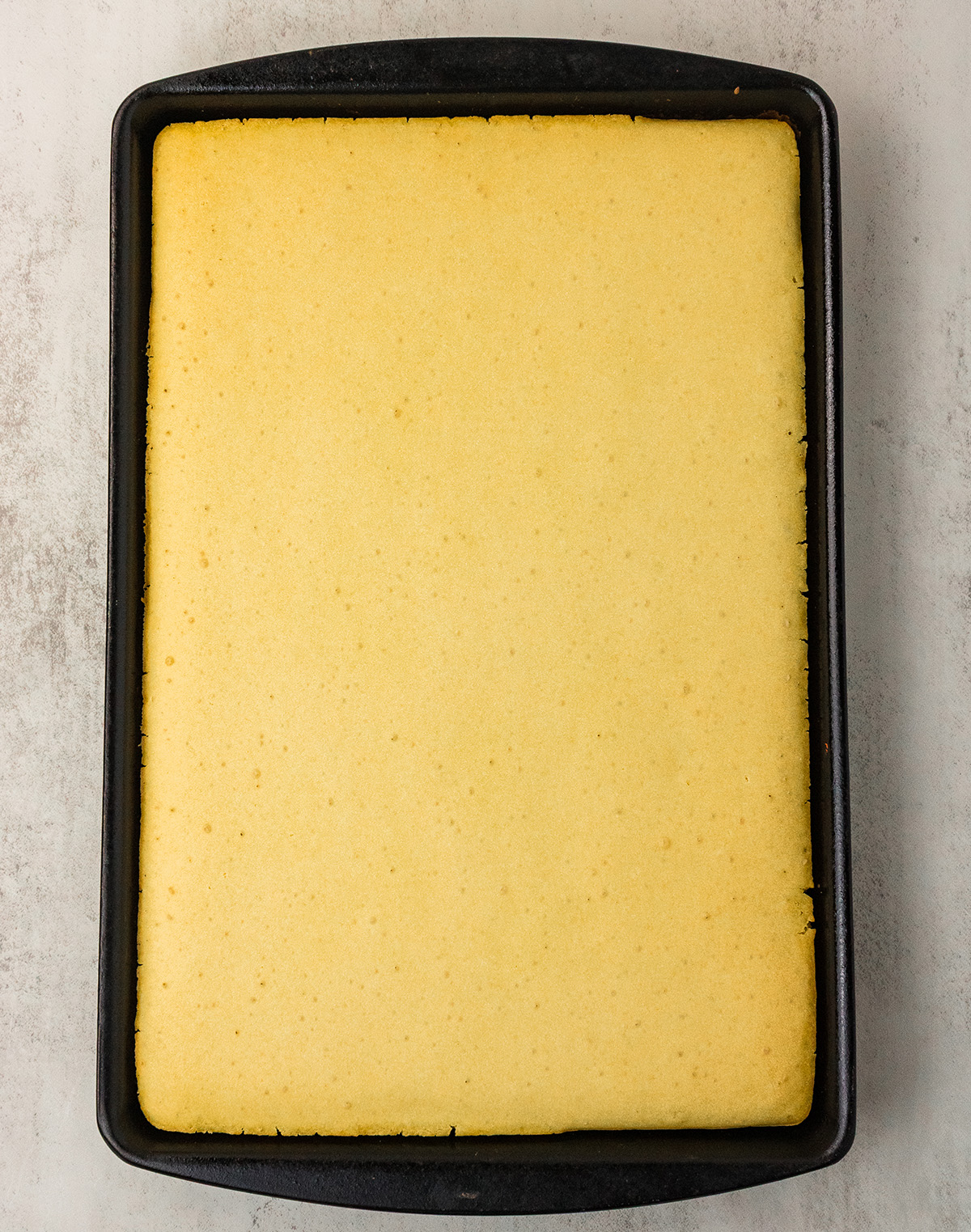 Golden baked vegan sheet pan pancakes fresh out of the oven.