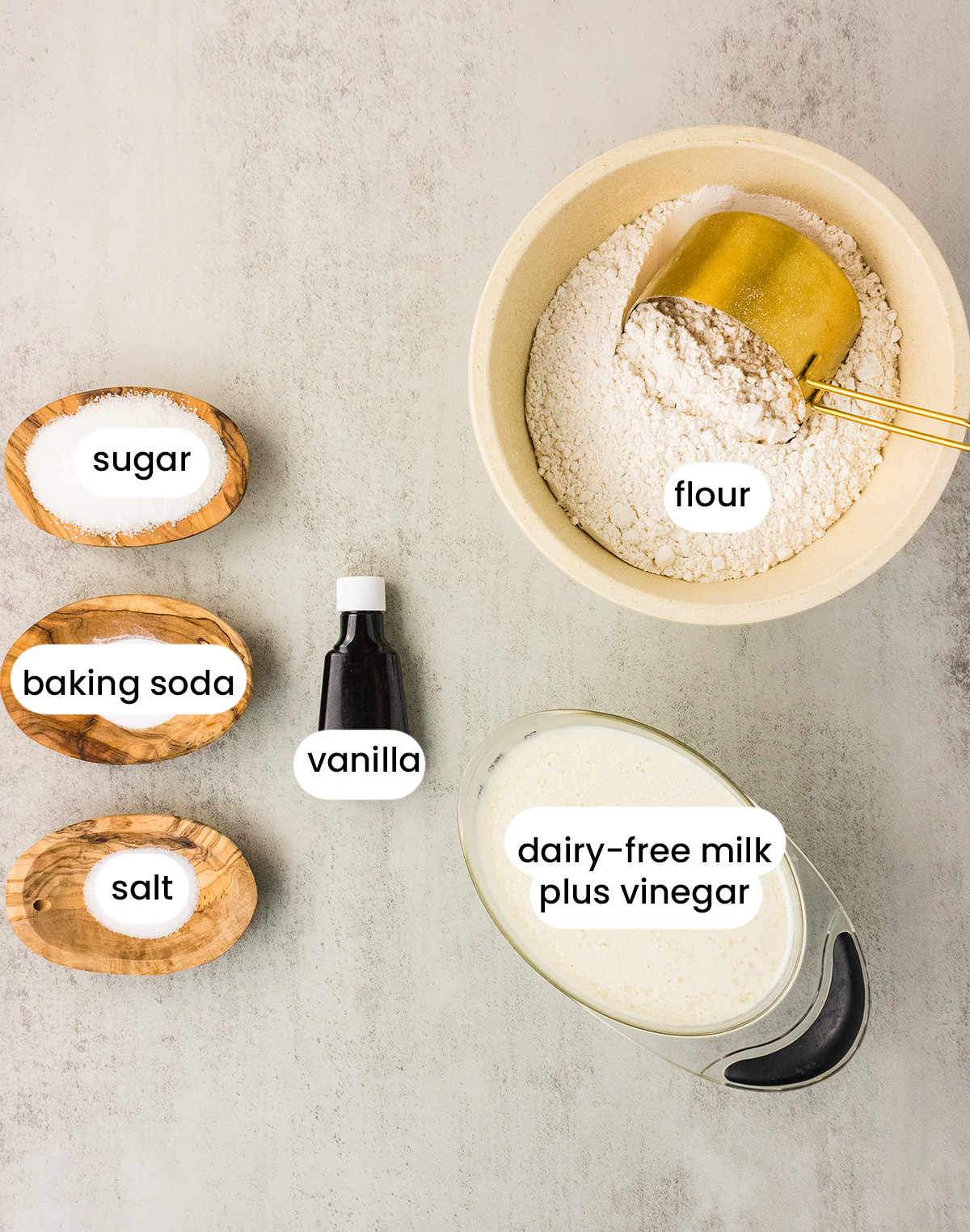 easy vegan sheet pan pancake recipe with dairy free buttermilk, flour, vanilla, baking soda, sugar, and salt.